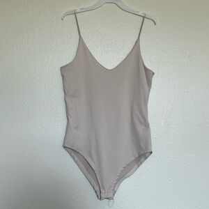Nude tan bodysuit with snap buttons